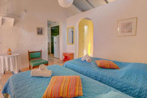 A bed or beds in a room at Lefkes Apartments