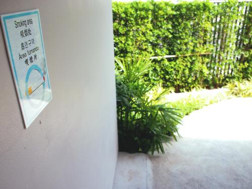 a sign that is on the side of a building at Good Night Pool Villa Phuket - SHA Plus in Phuket Town