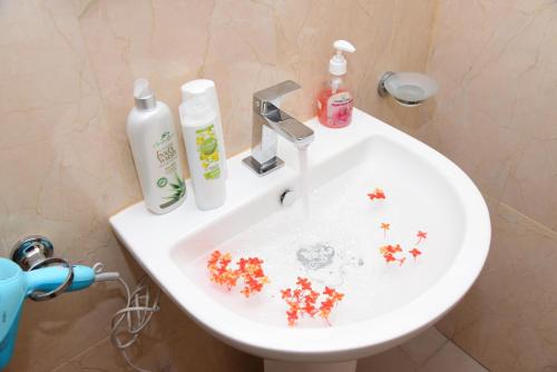 a bathroom sink with stars on it with a sink at White Villa Airport Transit Hotel in Katunayake
