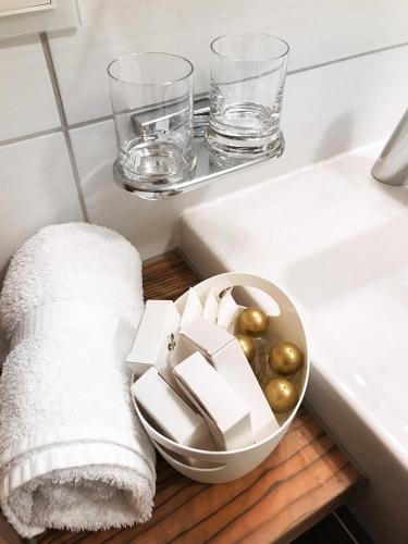 a bathroom with a bowl of food and a sink at Alpinlounge Rätia Appartements in Ischgl