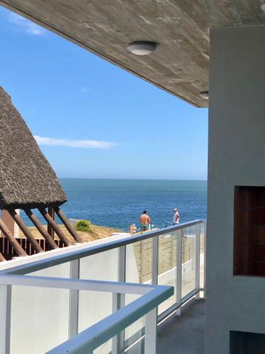 a view of the ocean from the balcony of a resort at Las Olas Aparts in La Paloma