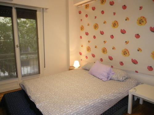a bedroom with a bed and a wall with hearts at By Lycabettus in the city-heart close to Acropolis in Athens
