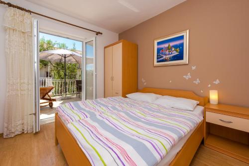 Tempat tidur dalam kamar di Villa Adria
