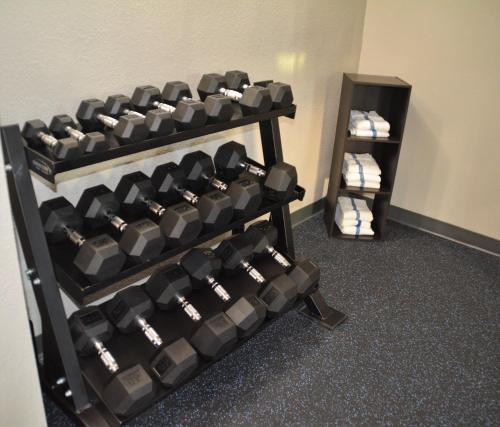 a rack of dumbbells in a room at Baymont by Wyndham Effingham in Effingham