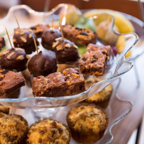a glass dish filled with chocolate desserts on a table at Belma Boutique Bed and Breakfast in Lima