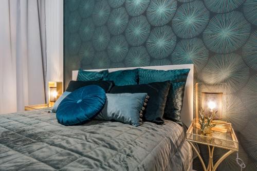 Posteľ alebo postele v izbe v ubytovaní Mennica Residence Chic Apartment