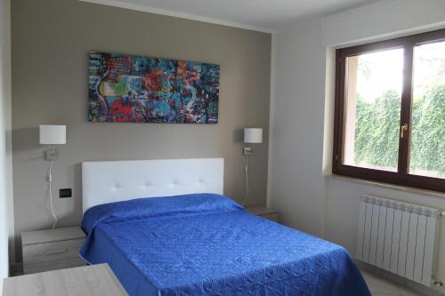 Postel nebo postele na pokoji v ubytování Case Così Apartments - Verona