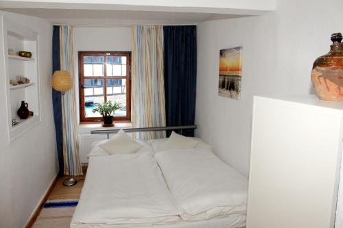 Posteľ alebo postele v izbe v ubytovaní Haus zum kleinen Helm