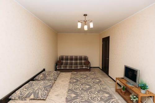Säng eller sängar i ett rum på Apartments On Novomestenskaya 7 floor