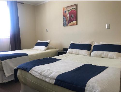Postel nebo postele na pokoji v ubytování Hotel Barba Lá
