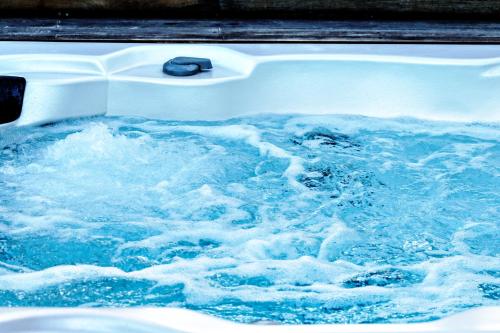 a large pool of blue water in a boat at Sicilia's Art Hotel & Spa in Acitrezza
