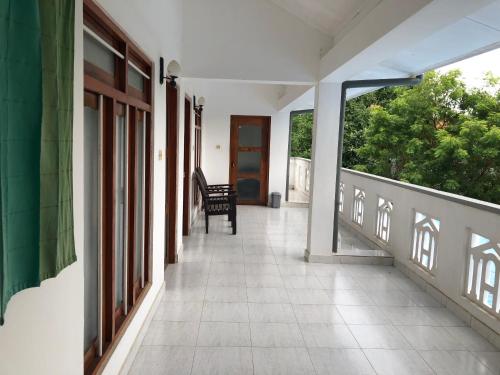 an empty hallway of a house with a porch at The Kent in Tissamaharama