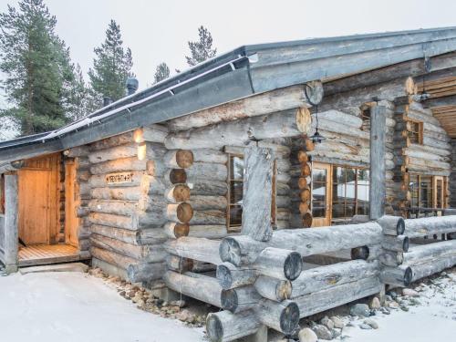 a log cabin in the snow at Holiday Home Mäentähti a by Interhome in Ruka