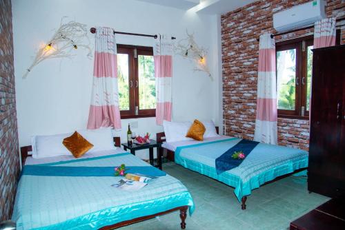 Song Huong Hotel Mui Neにあるベッド