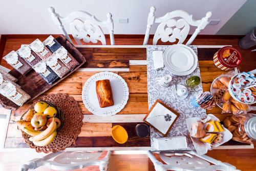 a table with bread and other food on it at Villa dei Pescatori in LʼAquila