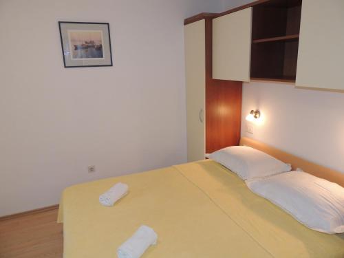 Ένα ή περισσότερα κρεβάτια σε δωμάτιο στο Seaside Apartments