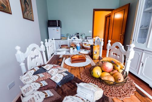 a dining room table with food on top of it at Villa dei Pescatori in LʼAquila