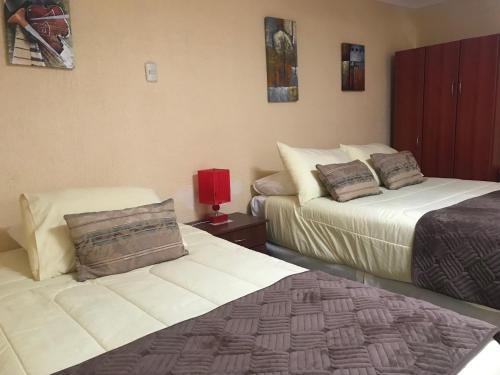 Postel nebo postele na pokoji v ubytování Hotel Barba Lá