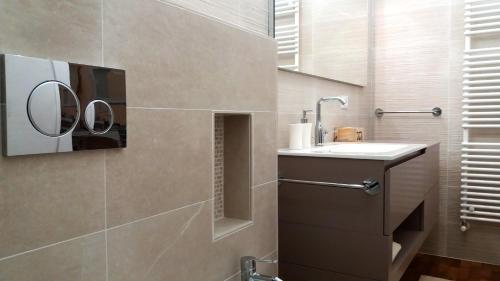 a bathroom with a sink and a mirror at Villa Bruna in Cesenatico