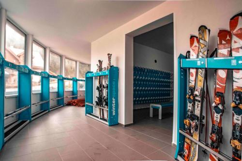 a room with a bunch of skis on display at Apartment No.7 Lúčky - Jasná in Demanovska Dolina