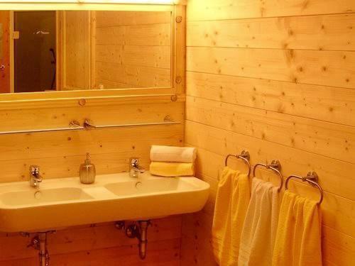 a bathroom with a sink and a mirror and towels at Landhaus Panorama in Reutte