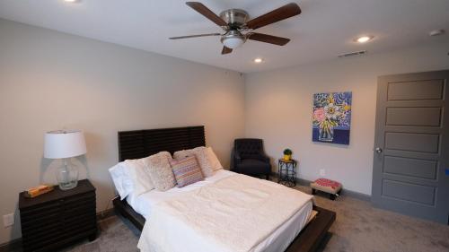 a bedroom with a bed and a ceiling fan at Southwest, NRG, GRB, MM Park, Downtown, Galleria, Medical Center - Imogene in Houston