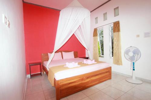 Katil atau katil-katil dalam bilik di Manta Manta Guesthouse