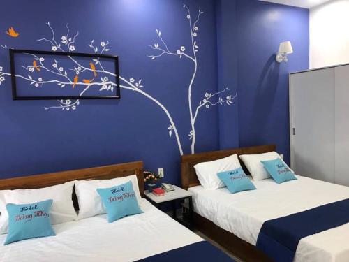 Katil atau katil-katil dalam bilik di Khách sạn Đăng Khoa