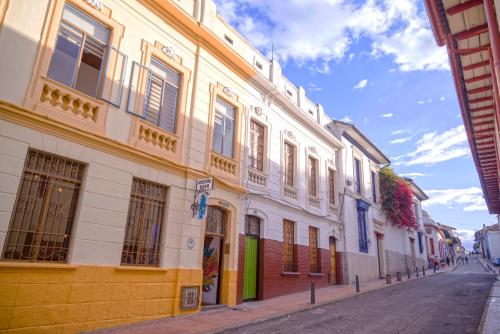 a row of buildings on the side of a street at Fatima Hostel Bogotá in Bogotá