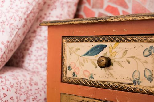 a picture frame with a painting of a snail on it at La Villetta in Pula