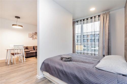 Postel nebo postele na pokoji v ubytování Apartments Vilnius 1 near center with a roof terrace and parking