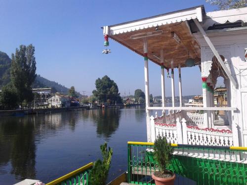 a house on the side of a river at S Group Of Houseboat in Srinagar