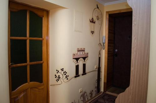 a hallway with a door and a room with a door at Babylon Apartments in Rivne