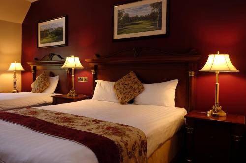 A bed or beds in a room at Racket Hall Country House Golf & Conference Hotel