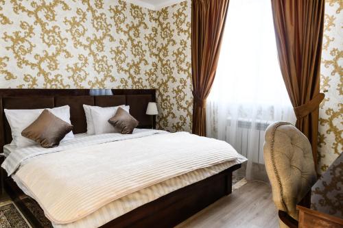 Кровать или кровати в номере Отель Саквояж