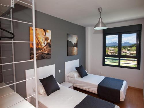 Posteľ alebo postele v izbe v ubytovaní For a Stay Las Dunas