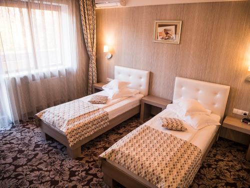 Una cama o camas en una habitación de Best Western Silva Hotel