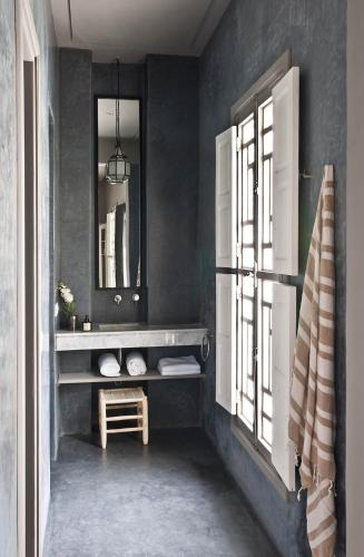 a bathroom with a sink and a mirror at Numa Marrakech in Marrakech