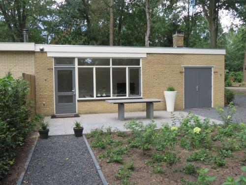 a building with a picnic table in front of it at 't Salehemse Huuske in Zelhem