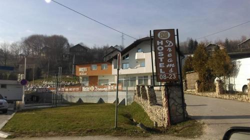 a sign for a hotel on the side of a road at Motel/Hostel Dreams in Novi Travnik