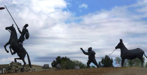 a statue of two men riding horses on a hill at Hostal Restaurante Ego's in Campo de Criptana