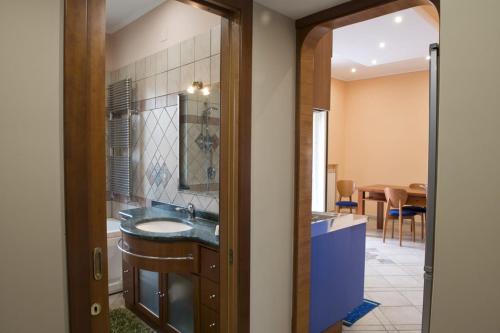 a bathroom with a sink and a mirror at Casa Chicco in Sorrento