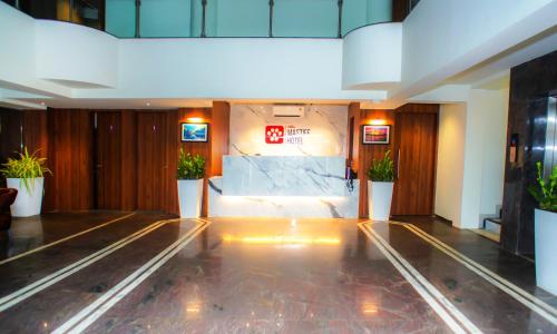 a lobby with a bowling alley in a building at Mastiff Hotel Chinchwad by OTHPL in Pune