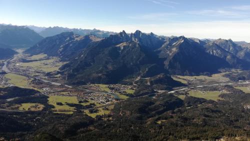 an aerial view of a mountain valley with a city at Haus Heiserer in Musau