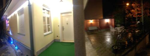 a hallway of a building with a green floor at Resident hill resort in Belgrade