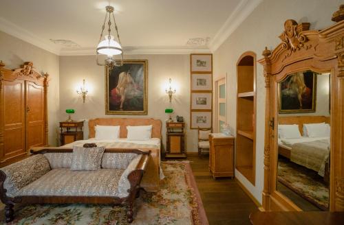 Postel nebo postele na pokoji v ubytování Vinotel Boutique Hotel