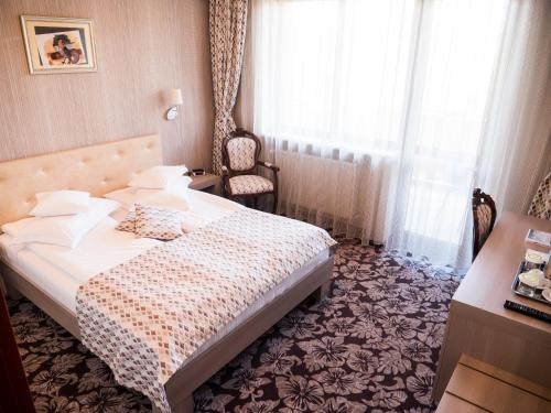 Una cama o camas en una habitación de Best Western Silva Hotel