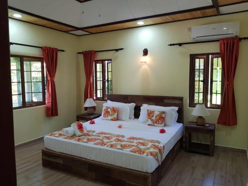 Кровать или кровати в номере La Passe Holiday Villa