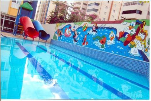 a swimming pool with a mural of a water park at Eldorado Park Caldas Novas in Caldas Novas