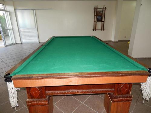 a pool table with a green top in a room at Eldorado Park Caldas Novas in Caldas Novas